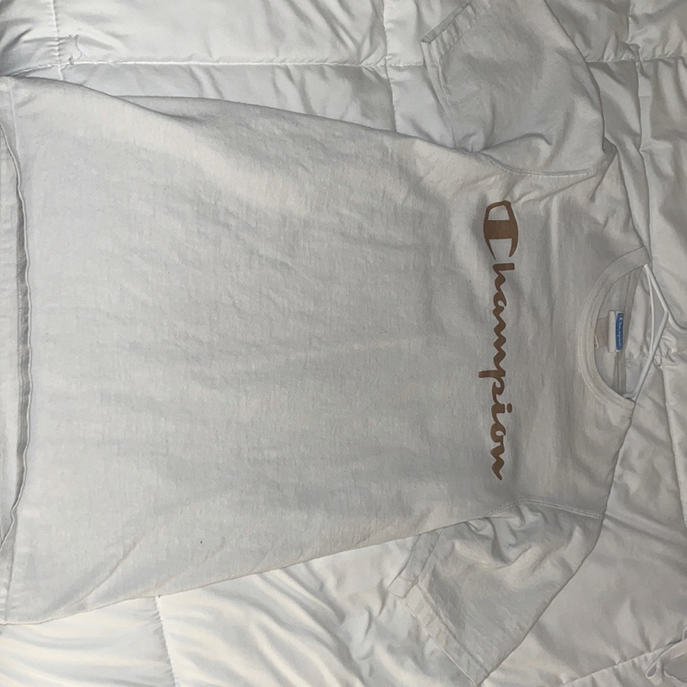 white champion shirt with gold lettering